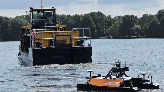 Surface vehicle “Otter” follows the weed-harvesting boat on Lake Maschsee